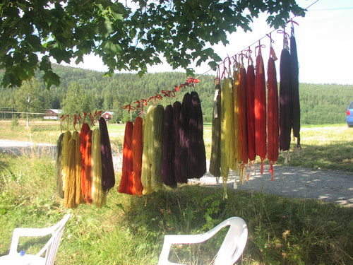 dyed yarns hanging on a line