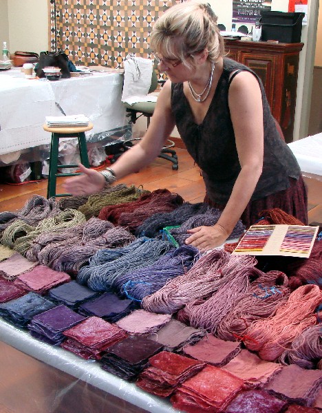 Instructor Charllotte Kwon color coordinating fibers dyed in class