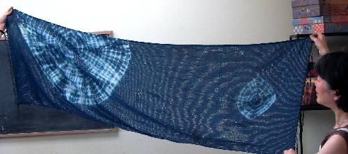 stitched scarf after several dips in the indigo vat