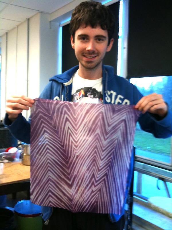 A student displaying his shibori work