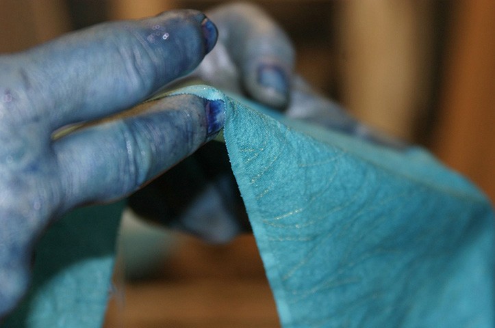 Indigo dyed fingers and fabric.