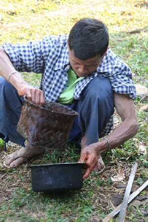 The yarn is then soaked in freshly made banana tree ash water.