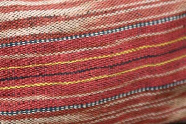 Detail of hand spun and back-strap woven cloth dyed with Morinda citrifolia