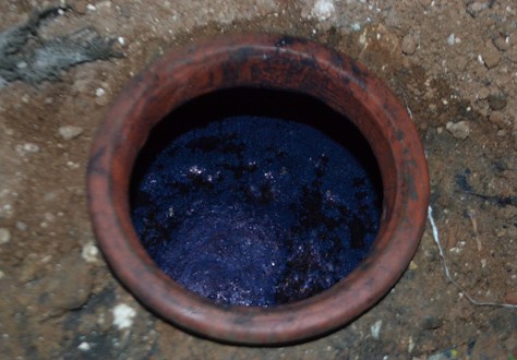 Natural indigo fermenting in an organic vat underground